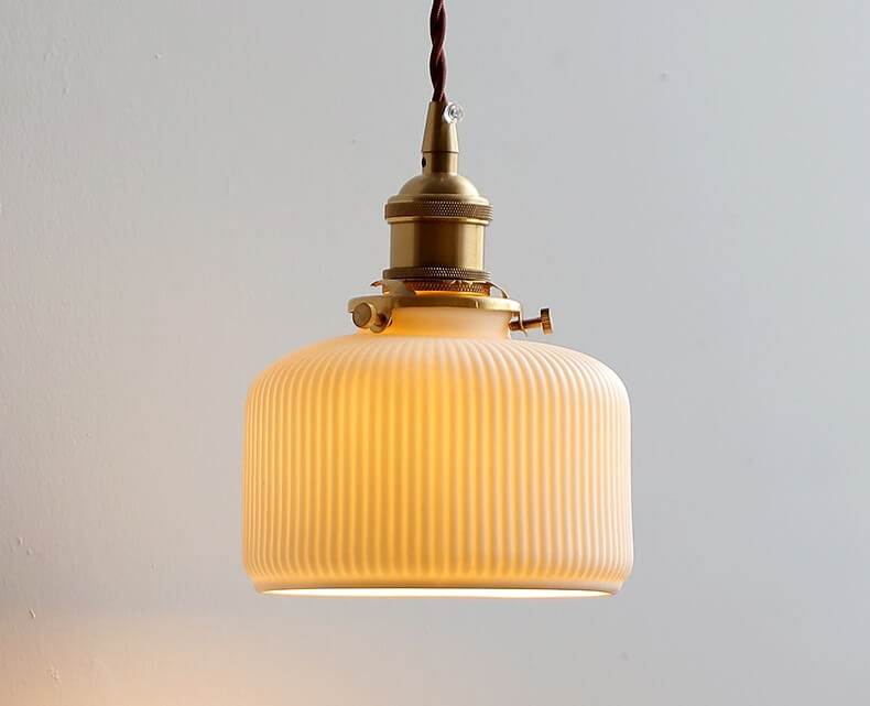 Japanese style ceramic wall lamp with copper arm and walnut canopy, featuring a modern design and white ceramic lampshade.