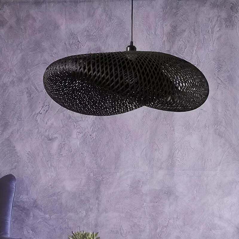 Black and beige bamboo weave pendant light fixture hanging in a room.