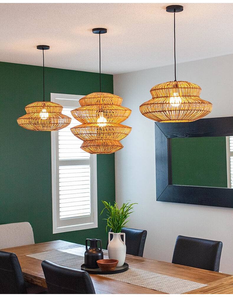 Boho rattan lamp hanging over kitchen island with elegant dining setup.