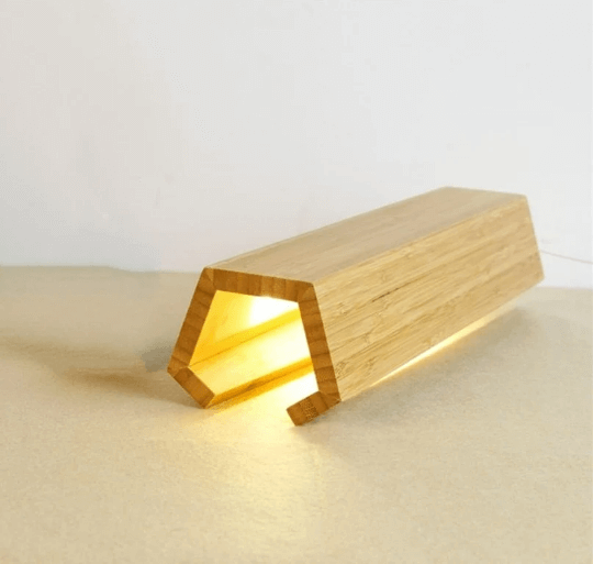 Eco-friendly bamboo LED wood desk lamp with smooth natural finish and adjustable brightness.