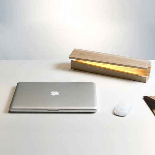 Eco-friendly bamboo LED wood desk lamp with smooth natural finish and adjustable brightness.
