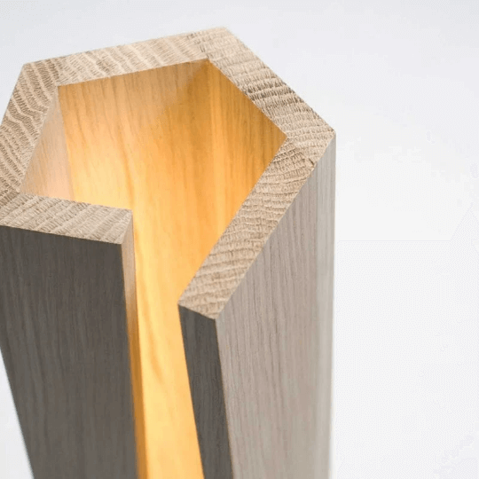 Eco-friendly bamboo LED wood desk lamp with smooth natural finish and adjustable brightness.