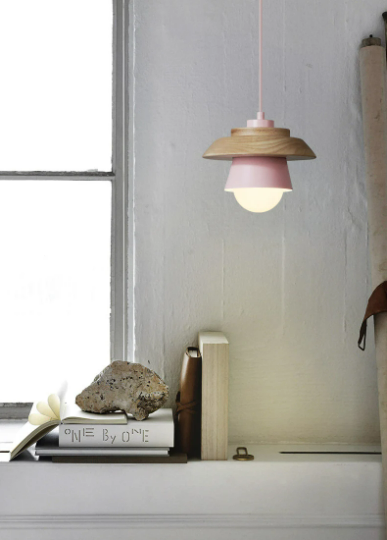 Sconce pendant light with iron and wood design, hanging over a dining table, in a modern Nordic droplight style.