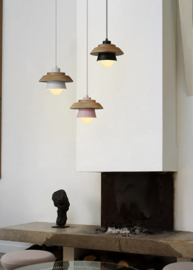 Sconce pendant light with iron and wood design, hanging over a dining table, in a modern Nordic droplight style.