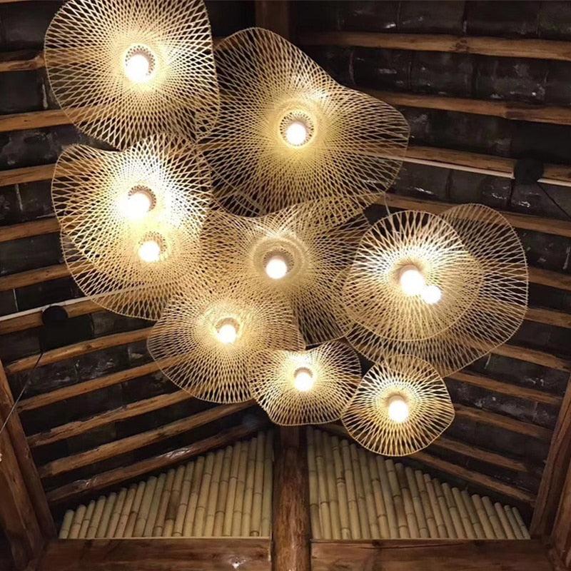 Handcrafted bamboo pendant lamp with butterfly design illuminating a modern interior space.