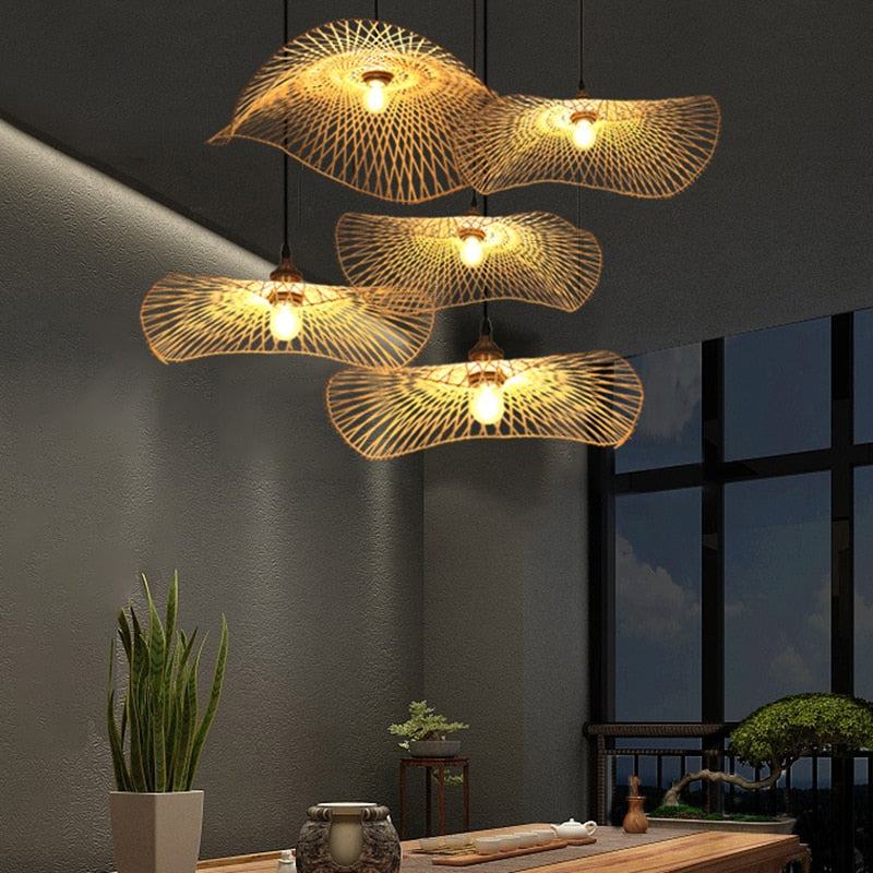Handcrafted bamboo pendant lamp with butterfly design illuminating a modern interior space.