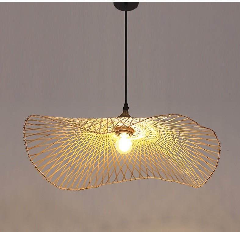 Handcrafted bamboo pendant lamp with butterfly design illuminating a modern interior space.