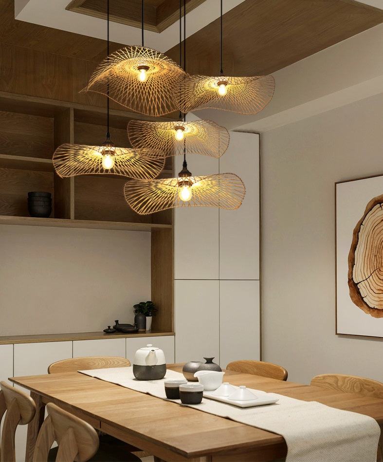 Handcrafted bamboo pendant lamp with butterfly design illuminating a modern interior space.