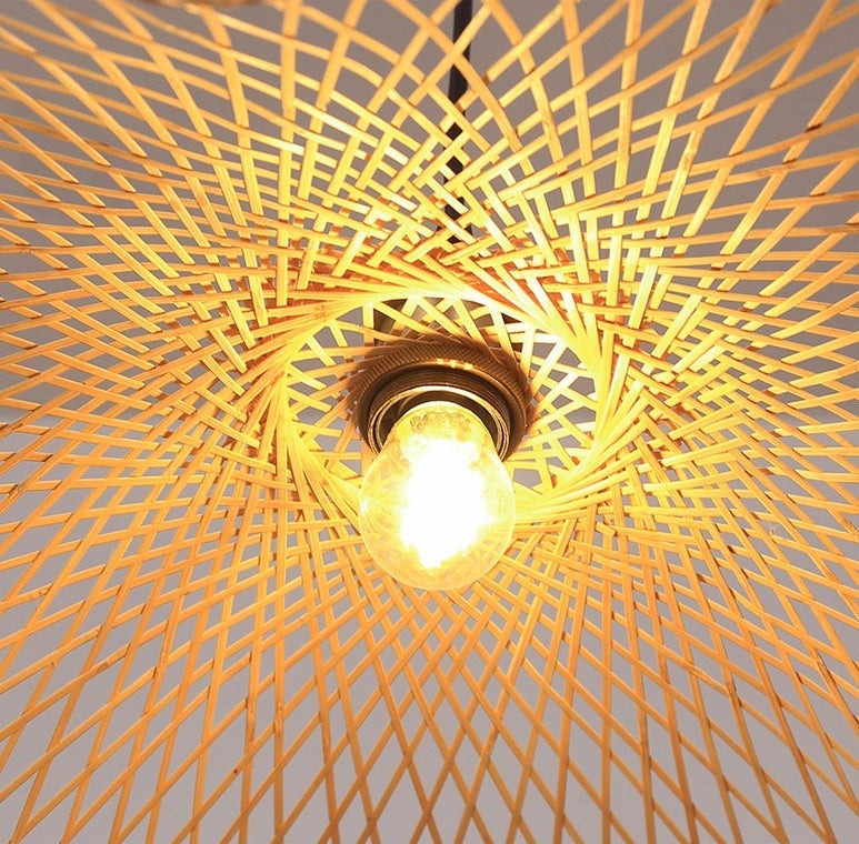 Handcrafted bamboo pendant lamp with butterfly design illuminating a modern interior space.