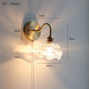 Glass wall lamp with pull chain switch, featuring a copper holder for durability and style.