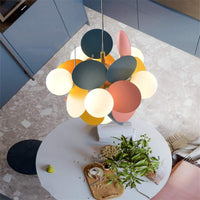 Colorful Branch Pendant Lamp with frosted glass globes and iron frame, adjustable cord for modern loft lighting.