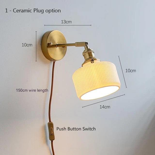 Ceramic adjustable wall lamp with pull chain switch, mounted on a copper fixture.