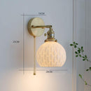 Japanese handmade ceramic wall scone with copper holders, featuring a white ceramic shade and integrated LED wall sconce, ideal for cozy and stylish settings.