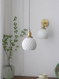 Japanese ceramic pendant lamp with copper holders, featuring a white ceramic shade and integrated LED wall sconce, ideal for cozy and stylish settings.