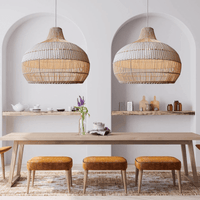 Japanese rattan lamps with white rattan lamp shades hanging over a dining table, showcasing hand-knitted craftsmanship and elegant design.