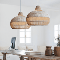 Japanese rattan lamps with white rattan lamp shades hanging over a dining table, showcasing hand-knitted craftsmanship and elegant design.