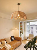 Natural rattan petal pendant light with lotus-inspired design, handcrafted from bamboo and rattan.