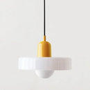 Nordic Glass Pendant Light in Candy Colors illuminating a minimalist interior space.