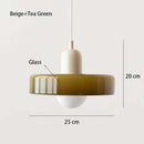 Nordic Glass Pendant Light in Candy Colors illuminating a minimalist interior space.