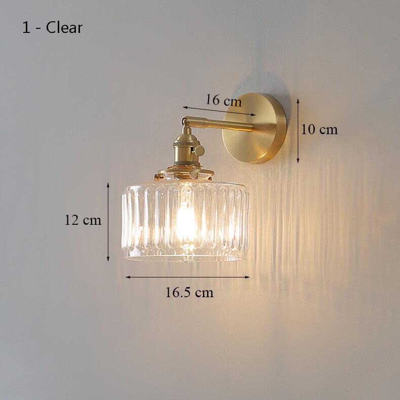 Clear Glass Wall Light LED with minimalist design, mounted above a bedside for cozy interior lighting.