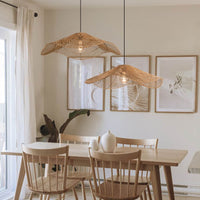 Retro Rattan Pendant Lamp in dining area with wooden furniture and soft lighting.