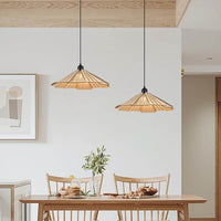 Retro straw hat wooden hanging lamps above dining table in cozy kitchen setting.