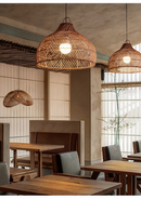 Vintage rattan hanging light with rustic look in a cozy dining space.