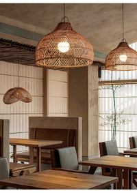 Vintage rattan hanging light with rustic look in a cozy dining space.