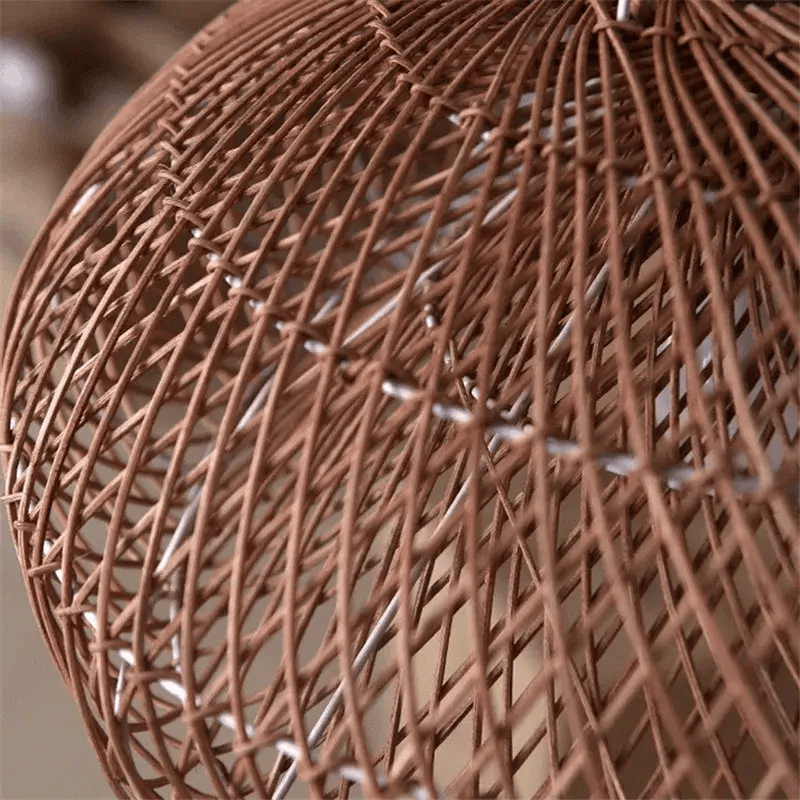 Vintage rattan hanging light with rustic look in a cozy dining space.