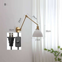 Modern ceramic wall lamp with copper swing arm and LED sconce, ideal for versatile home lighting.