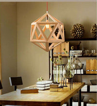 Geometric wooden pendant light with solid wood lampshade hanging in a stylish modern dining area.