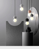 Nordic cement pendant lights with minimalist design in various colors, showcasing modern LED lighting.