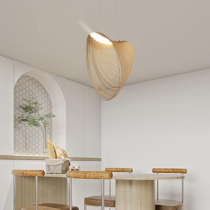 Nordic Wood Pendant Light with snail-shaped wood design and LED lighting above a modern interior setting.