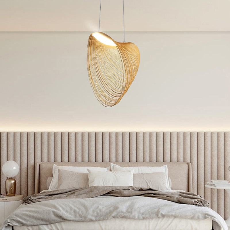 Nordic Wood Pendant Light with snail-shaped wood design and LED lighting above a modern interior setting.