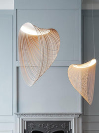 Nordic Wood Pendant Light with snail-shaped wood design and LED lighting above a modern interior setting.